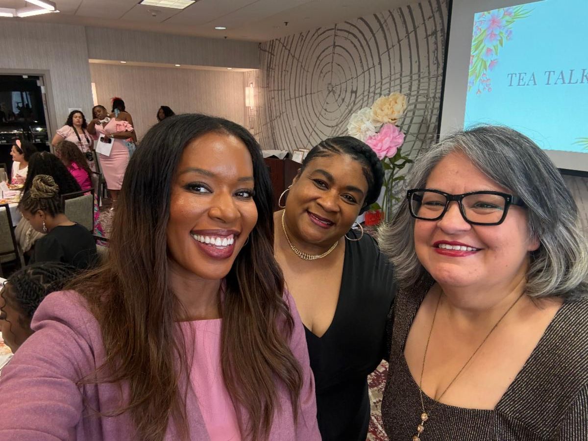 Photo of Mrs. Elain Lofton with two woman as she is being honored.