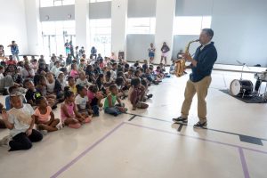 A saxaphoneist is playing